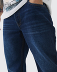 Boohooman Relaxed Rigid Flare Jean In Indigo